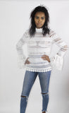 The 'SHAI SHAI' crochet top with large frill bell sleeve and high neck in off white